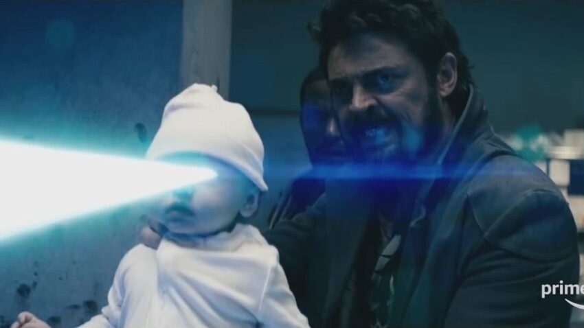 Photo pour la série The Boys avec Butcher (Karl Urban) tenant un bébé tirant des rayons laser avec ses yeux